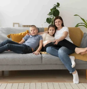 Snuggling on the Couch During a Family Photoshoot at Home